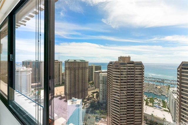 property's view of city featuring a water view