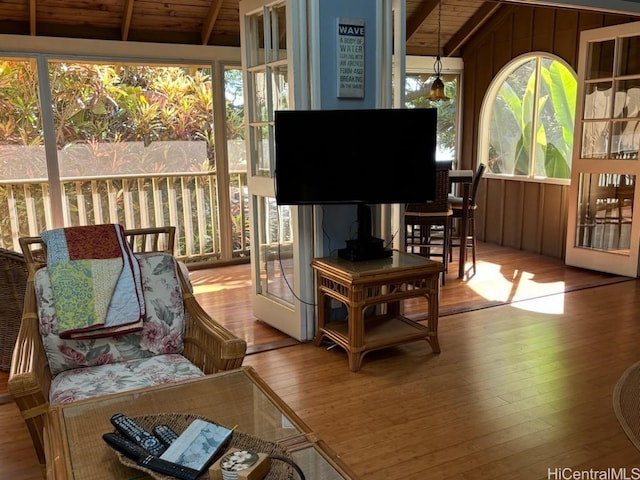 sunroom featuring vaulted ceiling with beams and wood ceiling