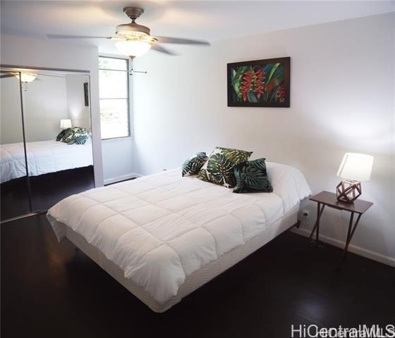 bedroom featuring ceiling fan and dark hardwood / wood-style flooring