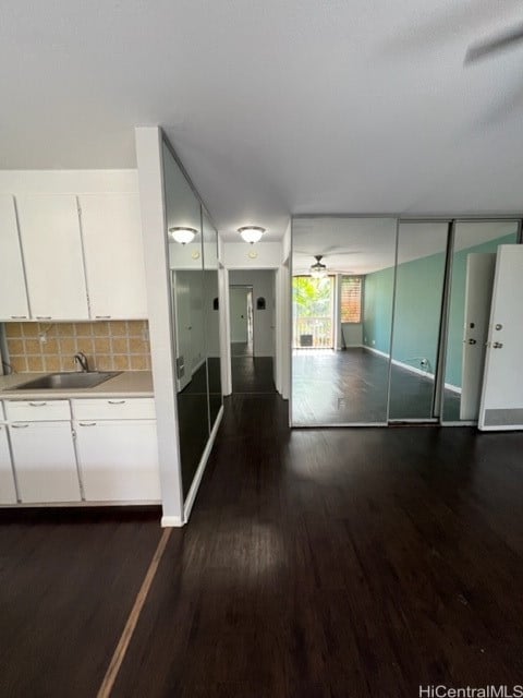 hall with sink and dark hardwood / wood-style flooring