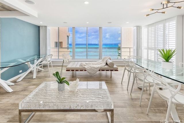 interior space featuring a chandelier and a water view