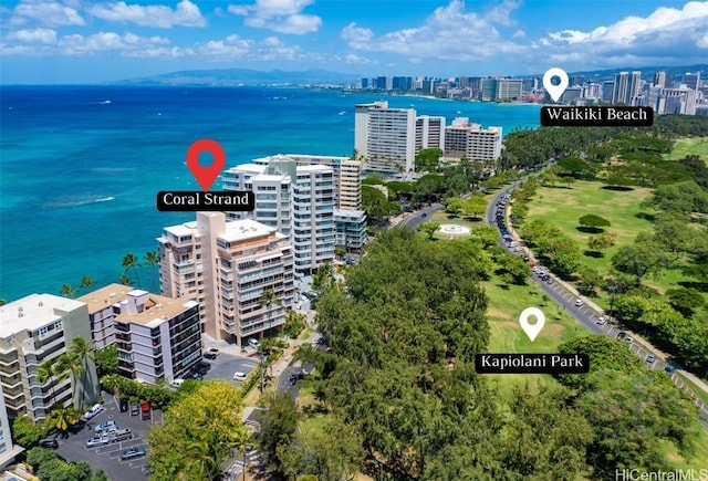 birds eye view of property featuring a water view and a city view