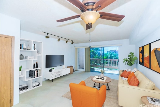 living room featuring ceiling fan, light colored carpet, and rail lighting