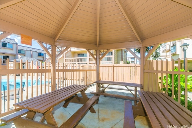 view of patio / terrace with a gazebo and a community pool