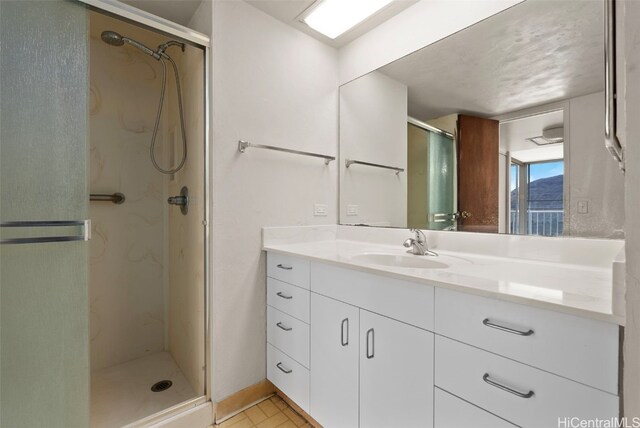 bathroom with vanity and an enclosed shower