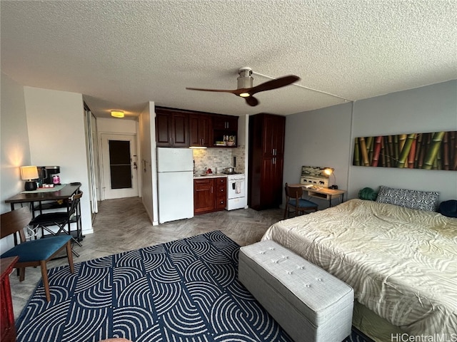 bedroom with a textured ceiling, ceiling fan, and white refrigerator