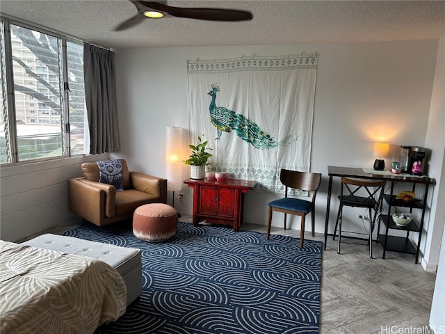 sitting room featuring a textured ceiling