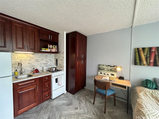 kitchen featuring white appliances, sink, backsplash, a textured ceiling, and light parquet floors