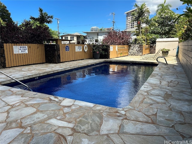 view of pool featuring a patio