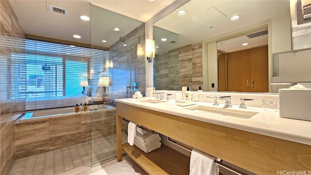 bathroom with vanity and a shower with shower door