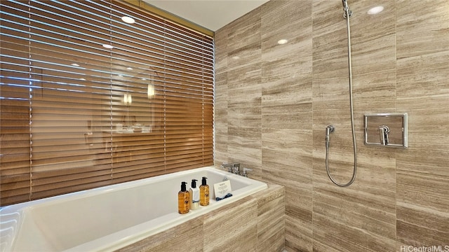 bathroom with separate shower and tub