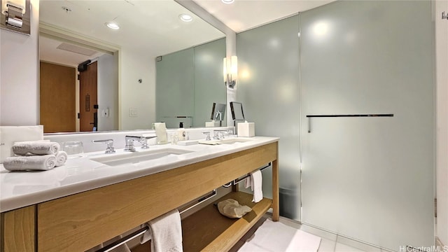 bathroom with vanity and tile patterned flooring