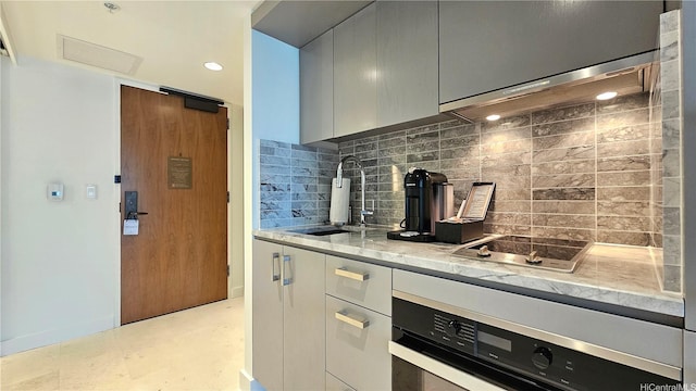 383 Kalaimoku St Unit E2001, Honolulu, HI 96815 - kitchen with backsplash, modern cabinets, a sink, and wall oven