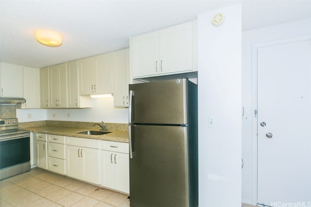 kitchen featuring ventilation hood, white cabinets, sink, light tile patterned floors, and stainless steel appliances