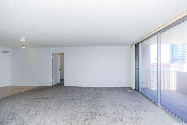 1561 Kanunu St Unit 1205, Honolulu, HI 96814 - carpeted spare room with a textured ceiling