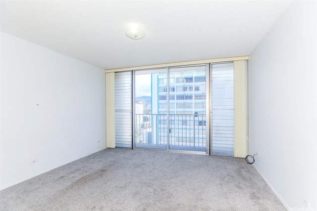 1561 Kanunu St Unit 1205, Honolulu, HI 96814 - carpeted spare room with floor to ceiling windows