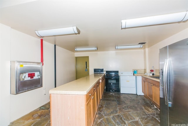 1561 Kanunu St Unit 1205, Honolulu, HI 96814 - kitchen with appliances with stainless steel finishes, washer / clothes dryer, dark stone finish flooring, a peninsula, and light countertops