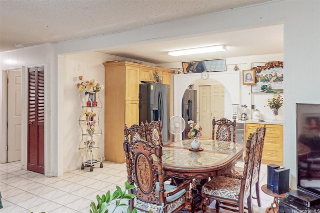 92-746 Palailai St, Kapolei, HI 96707 - dining area featuring arched walkways, light tile patterned flooring, and a textured ceiling