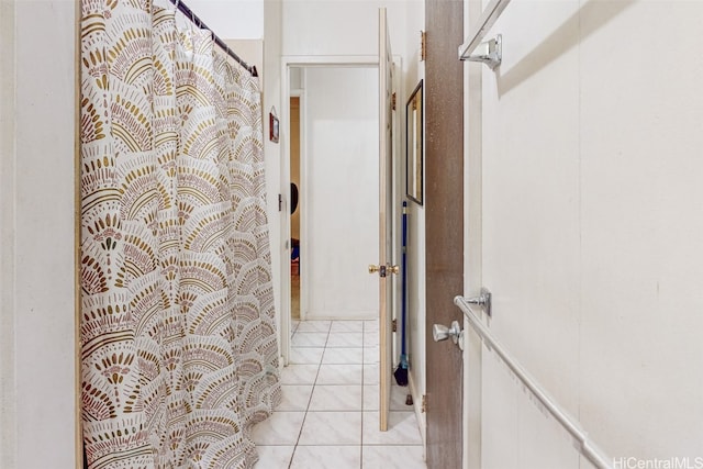 hall with light tile patterned flooring