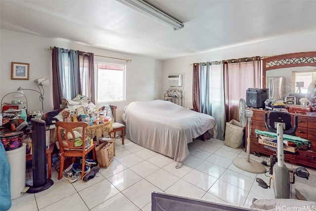 bedroom with a wall mounted AC and light tile patterned floors