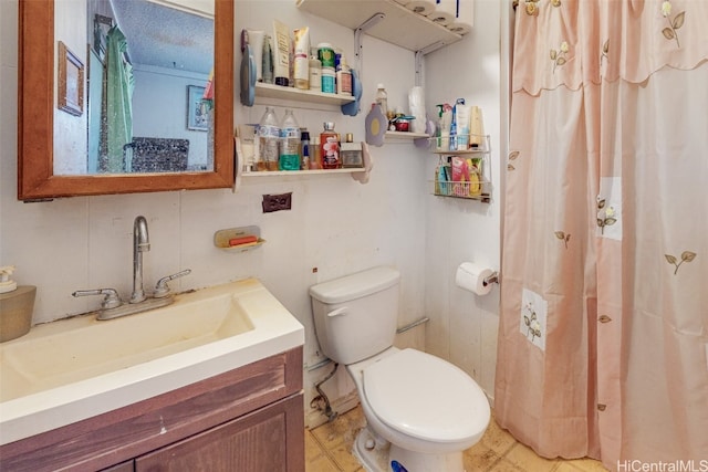 bathroom with toilet, a textured ceiling, a shower with curtain, and vanity