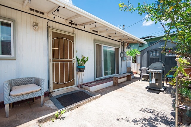 entrance to property featuring a patio