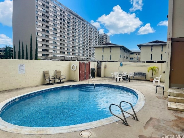 view of swimming pool featuring a patio