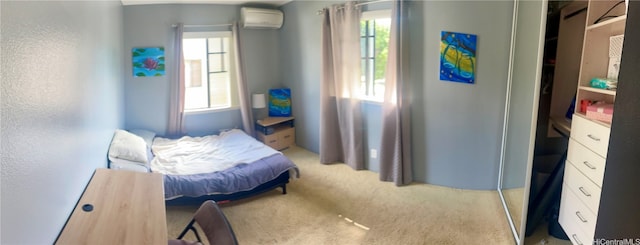 carpeted bedroom with a wall mounted AC and multiple windows