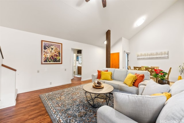 living room featuring ceiling fan, high vaulted ceiling, and dark hardwood / wood-style floors