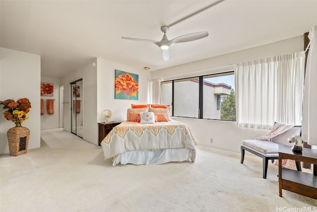 bedroom with ceiling fan and light colored carpet