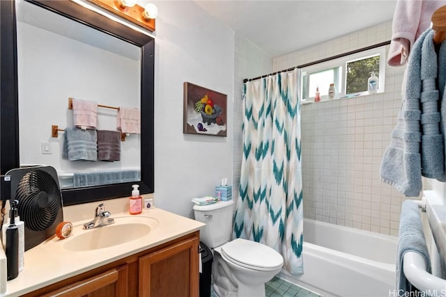 full bathroom featuring vanity, shower / tub combo, and toilet