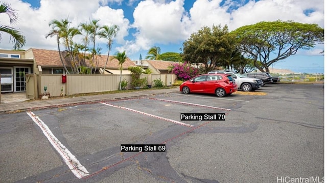 uncovered parking lot with fence