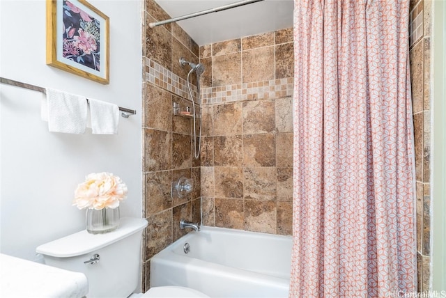 bathroom with shower / bath combination with curtain and toilet