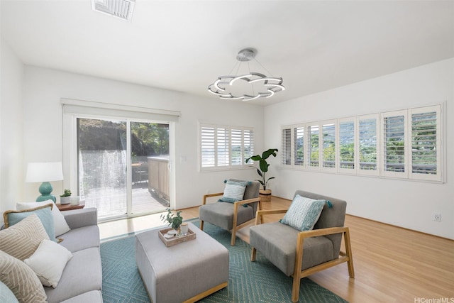 2897 Kalawao St Unit 61, Honolulu, HI 96822 - living room with a chandelier and wood finished floors
