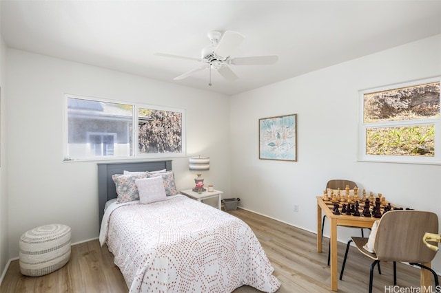 bedroom featuring a ceiling fan and light wood-type flooring