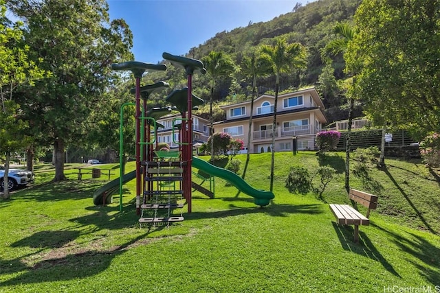 communal playground featuring a yard