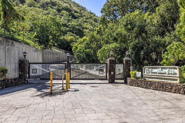 view of gate with fence