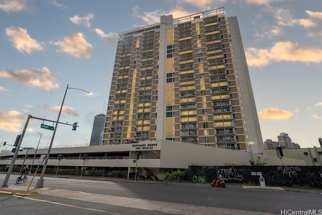 view of outdoor building at dusk