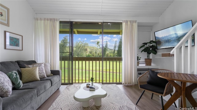 sunroom with lofted ceiling and wood ceiling