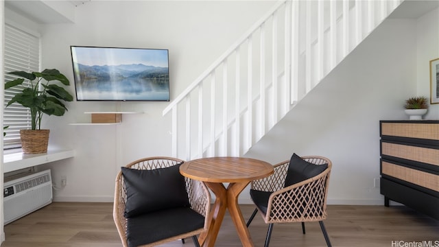 dining room featuring light hardwood / wood-style flooring and radiator heating unit