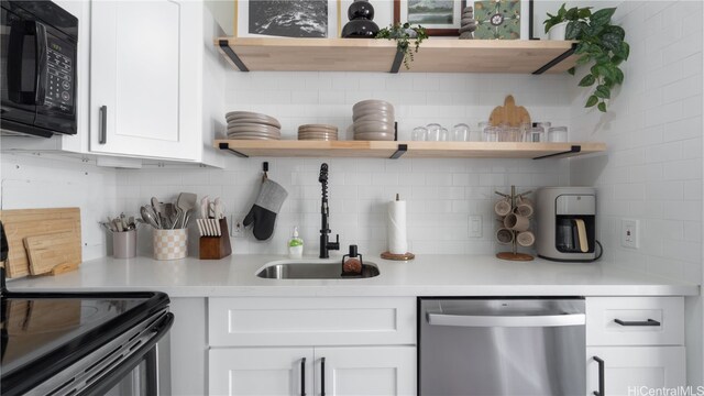 bar with white cabinetry, black appliances, and sink