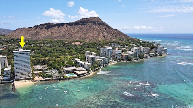 aerial view featuring a water and mountain view