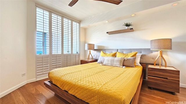 bedroom featuring hardwood / wood-style flooring and ceiling fan