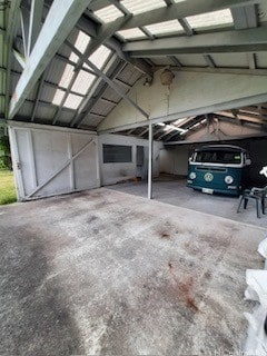 garage featuring a carport