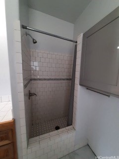 bathroom with tiled shower