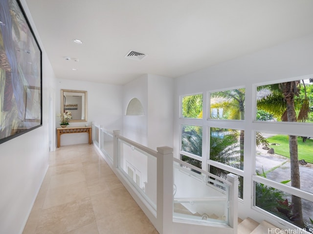 hall with light tile patterned flooring