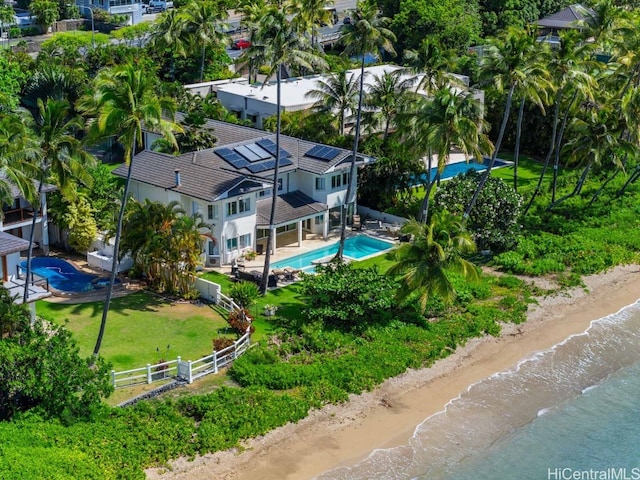 drone / aerial view featuring a view of the beach and a water view