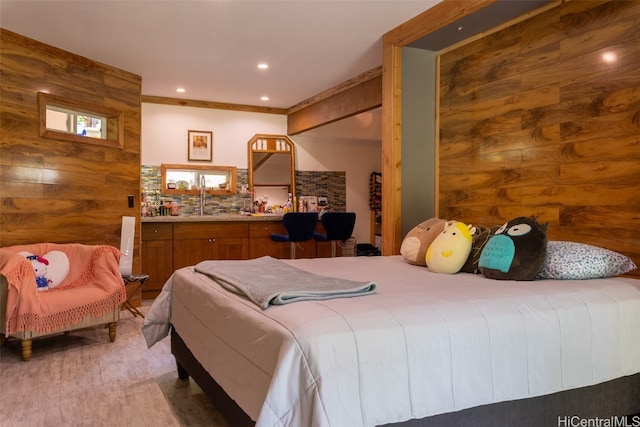 bedroom with log walls, sink, and wood-type flooring