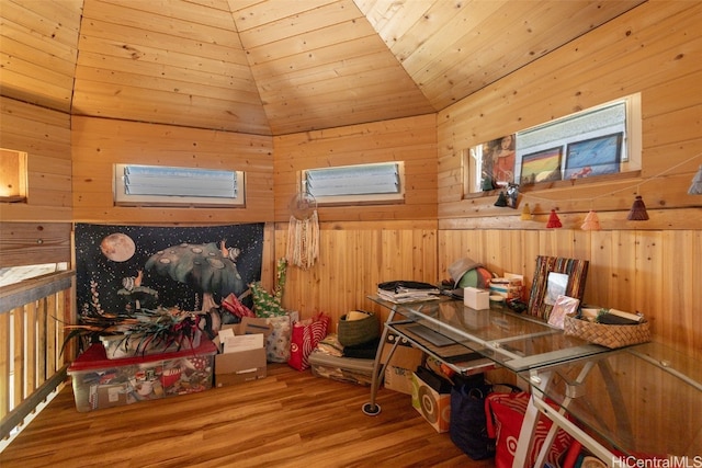 interior space featuring wood ceiling, vaulted ceiling, wooden walls, and hardwood / wood-style floors