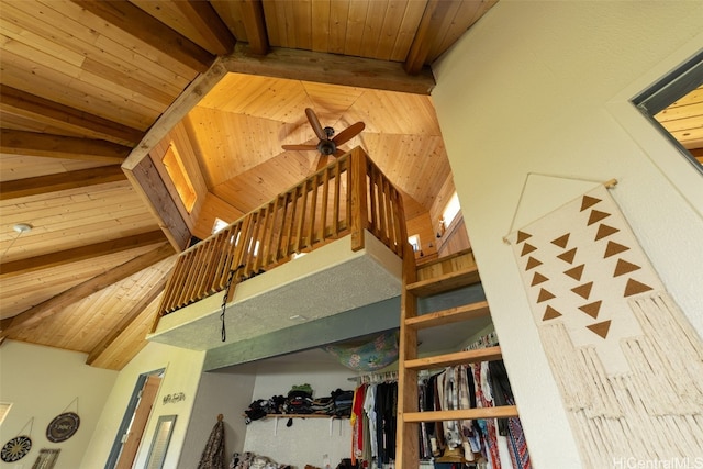 stairway with lofted ceiling with beams and wooden ceiling